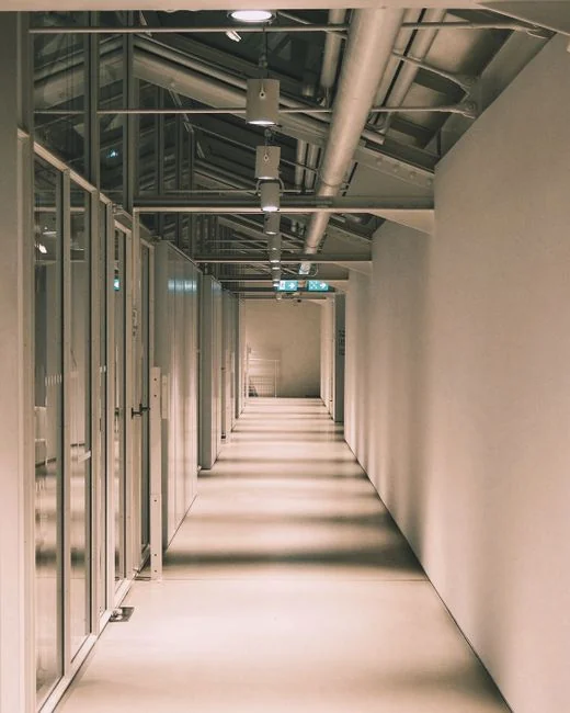 Cleaner cleaning the floor in a laboratory environment